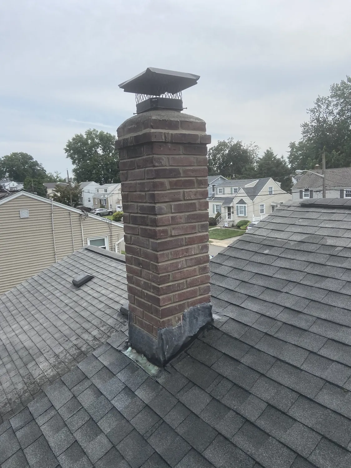 Chimney masonry and roof leak prevention work by All United Construction in New Jersey